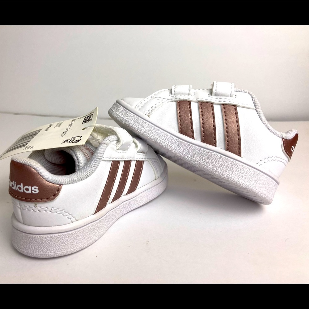 Adidas Grand Court 1 Tennis Shoes. White with rose gold stripes.